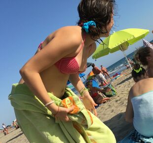 Candid young Beach nipple glide